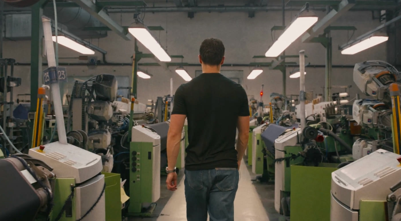 Nero founder walking through the production facility where the shorts are made